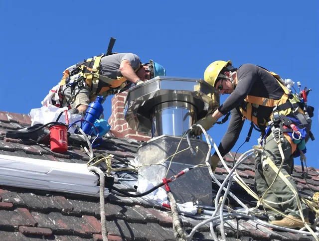 Protective chimney cap installed by Akron Chimney Sweep in Akron, OH