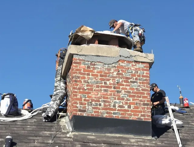 Akron Chimney Sweep installing a custom chimney crown in Akron, OH
