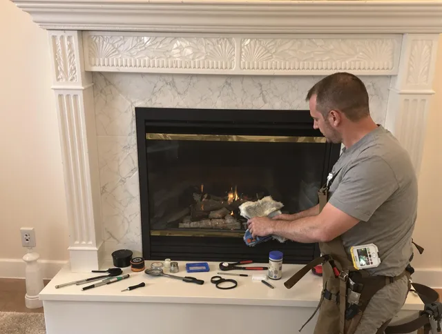 Akron Chimney Sweep performing fireplace maintenance in Akron, OH